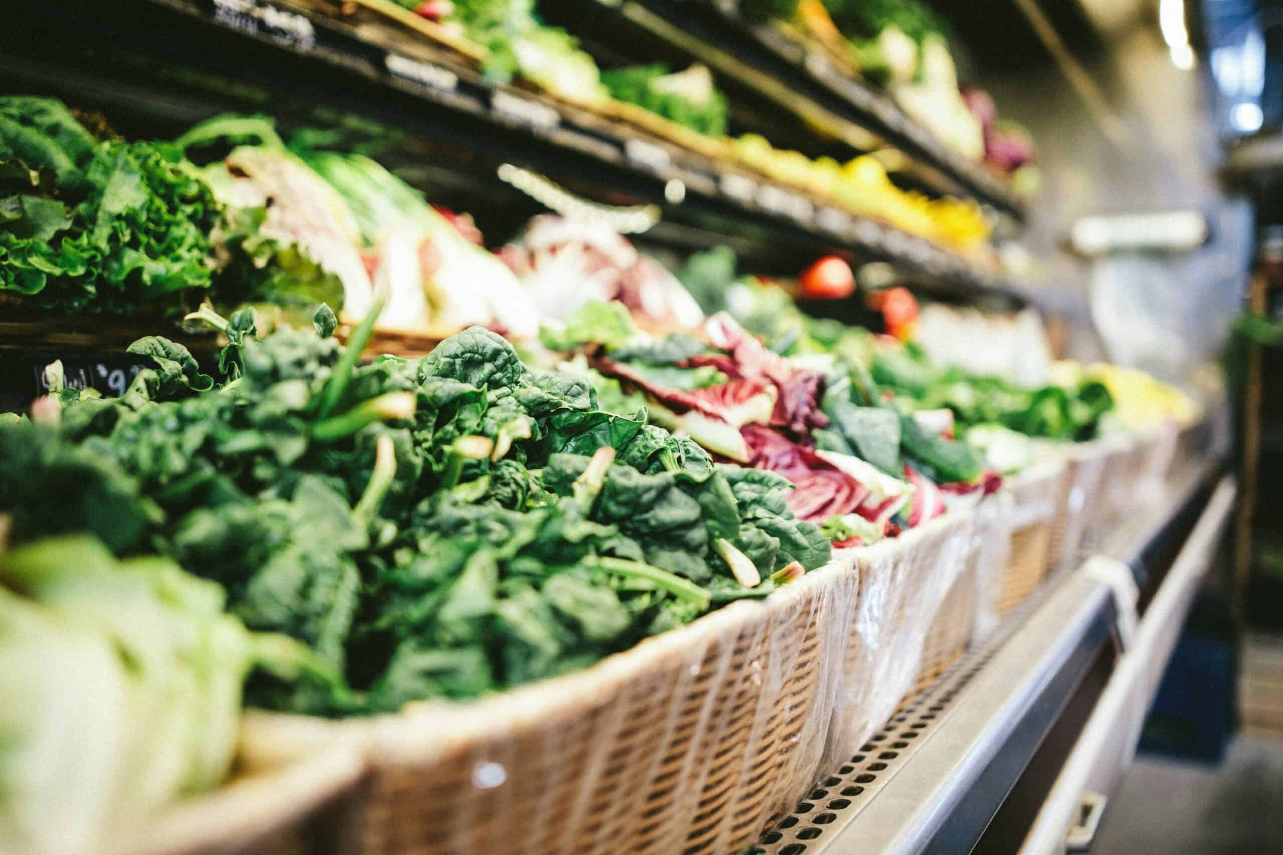 scott-warman-NpNvI4ilT4A-unsplash Produce shelves at a grocery store