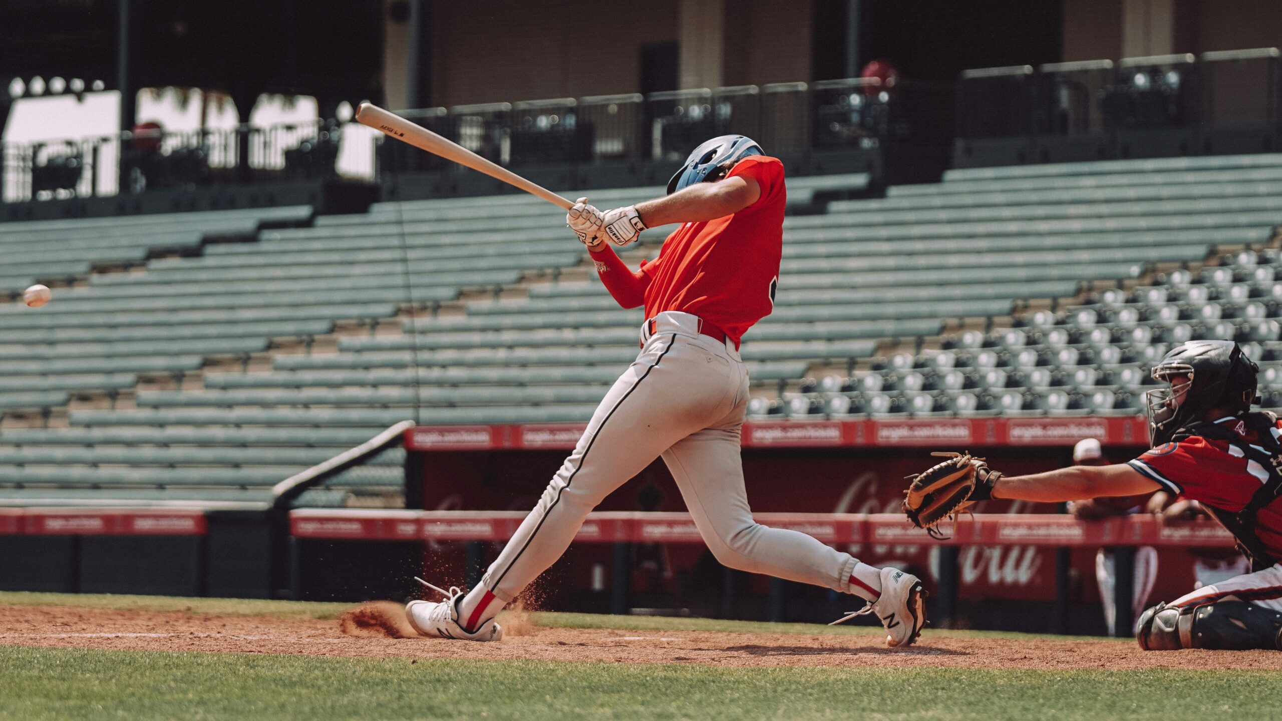 josh-hemsley-e-f17L4EBBc-unsplash Baseball batter swinging at incoming pitch in baseball game