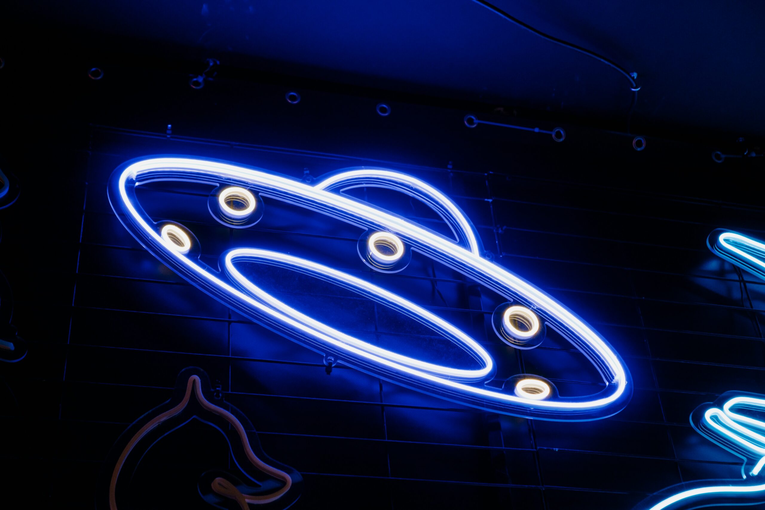 Blue spaceship neon sign
